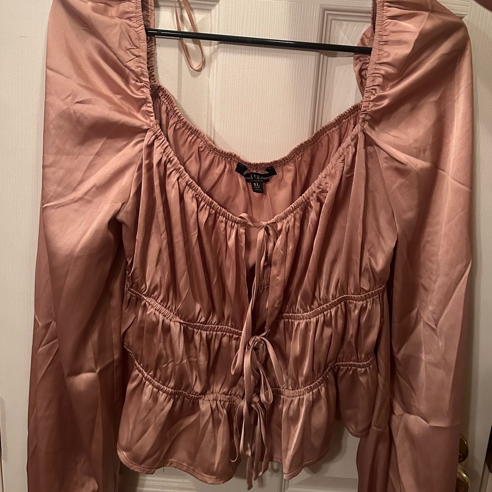 Pink top with open center ties